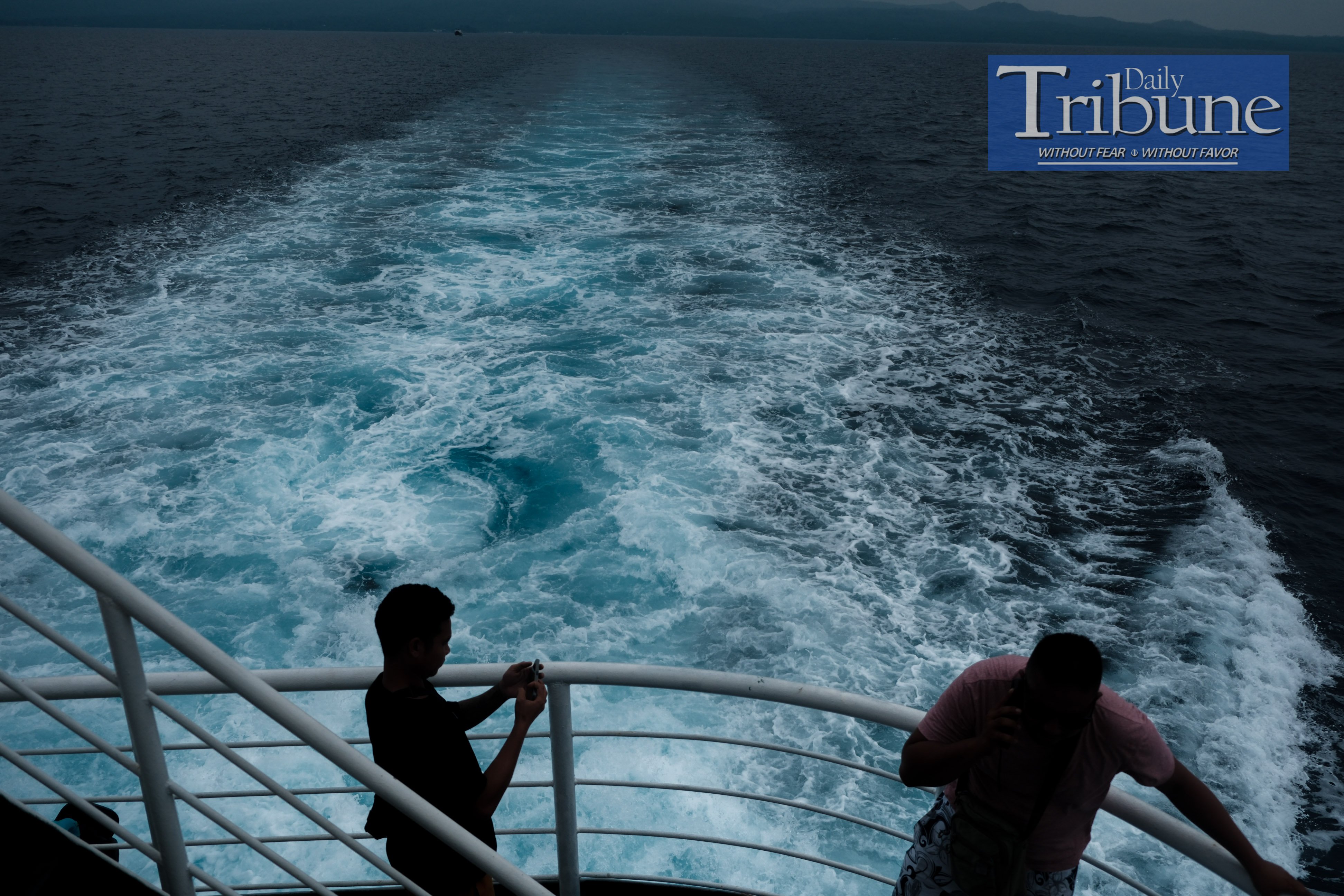(FILE PHOTO) Ferry passengers enjoy the scenic view of the blue sea as they sail to Camiguin Island on 20 September, 2024.