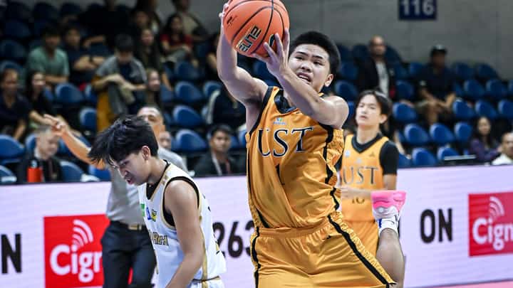 ANDWELE Cabañero of UST pulls down the rebound during their Season 87 UAAP Junior High School basketball tournament match against NUNS. The Tiger Cubs prevailed, 84-83.