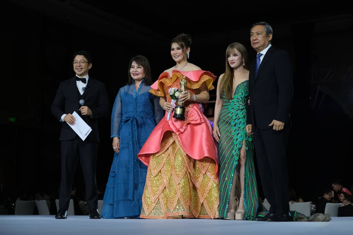 Cristina Dy-Carlos Deleste from Iligan City, receives her award as one of honorees during the bdwp gala from Consul Marian Ong, selection committee member Mags Cue, and board member Charlie Rufino.