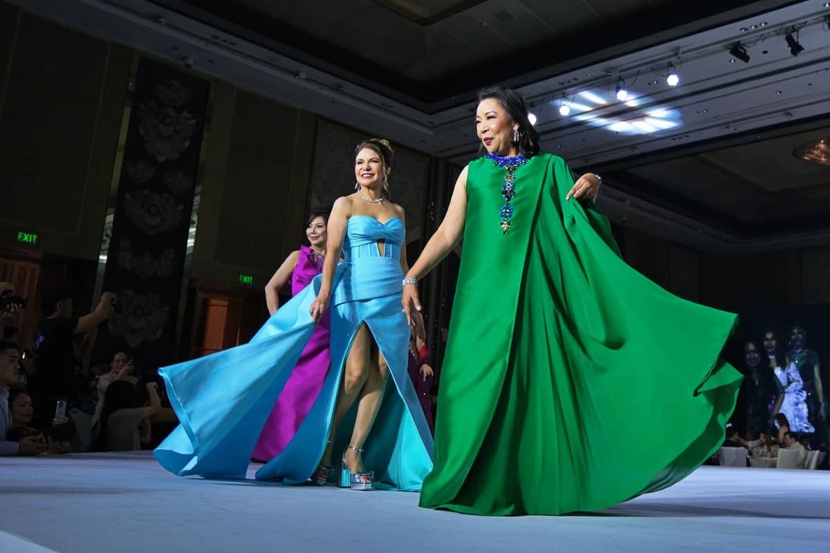 Dr. Liza Quirolgico, Dr. Elsie Pascua, and Rosemarie Bosch Ong walk the runway among the Best Dressed Women of the Philippines 2024.