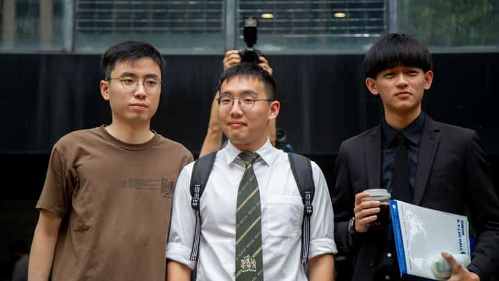 From left: Former University of Hong Kong student leaders Yung Chung-hei, Charles Kwok and Chris Todorovski outside the District Court in Wan Chai on 11 September 2023.