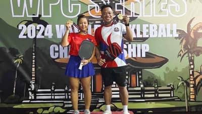 BIEN Zoleta and Johner Ombrezo celebrate after winning the gold medal in the doubles 35+ Open Category event of the World Pickleball Championships.