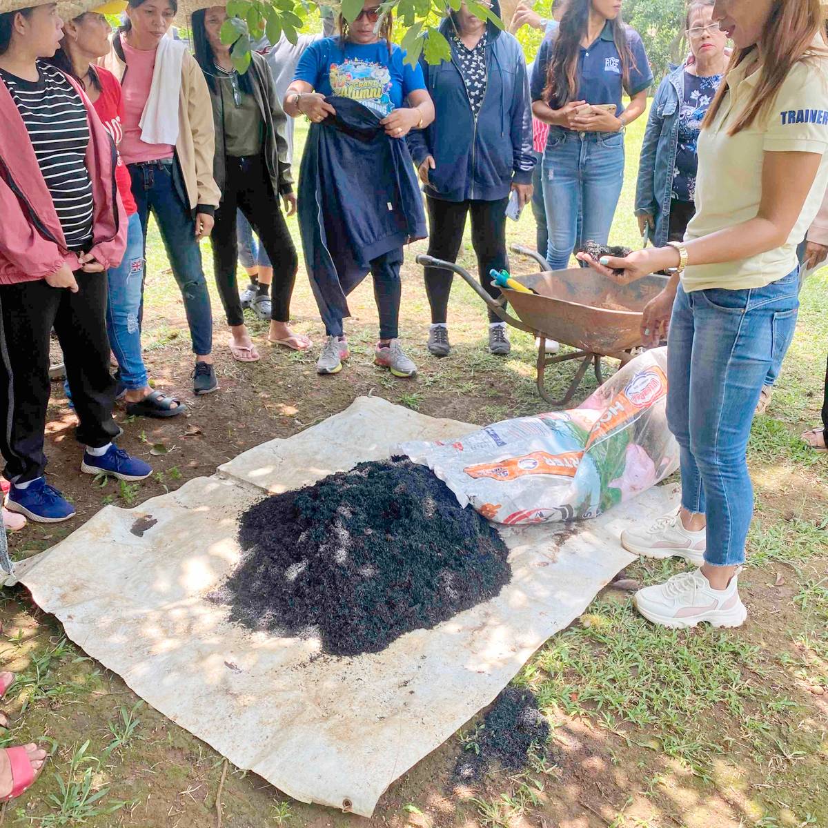 mixing the husks as it burns and sprinkling the burnt rice hulls with water.