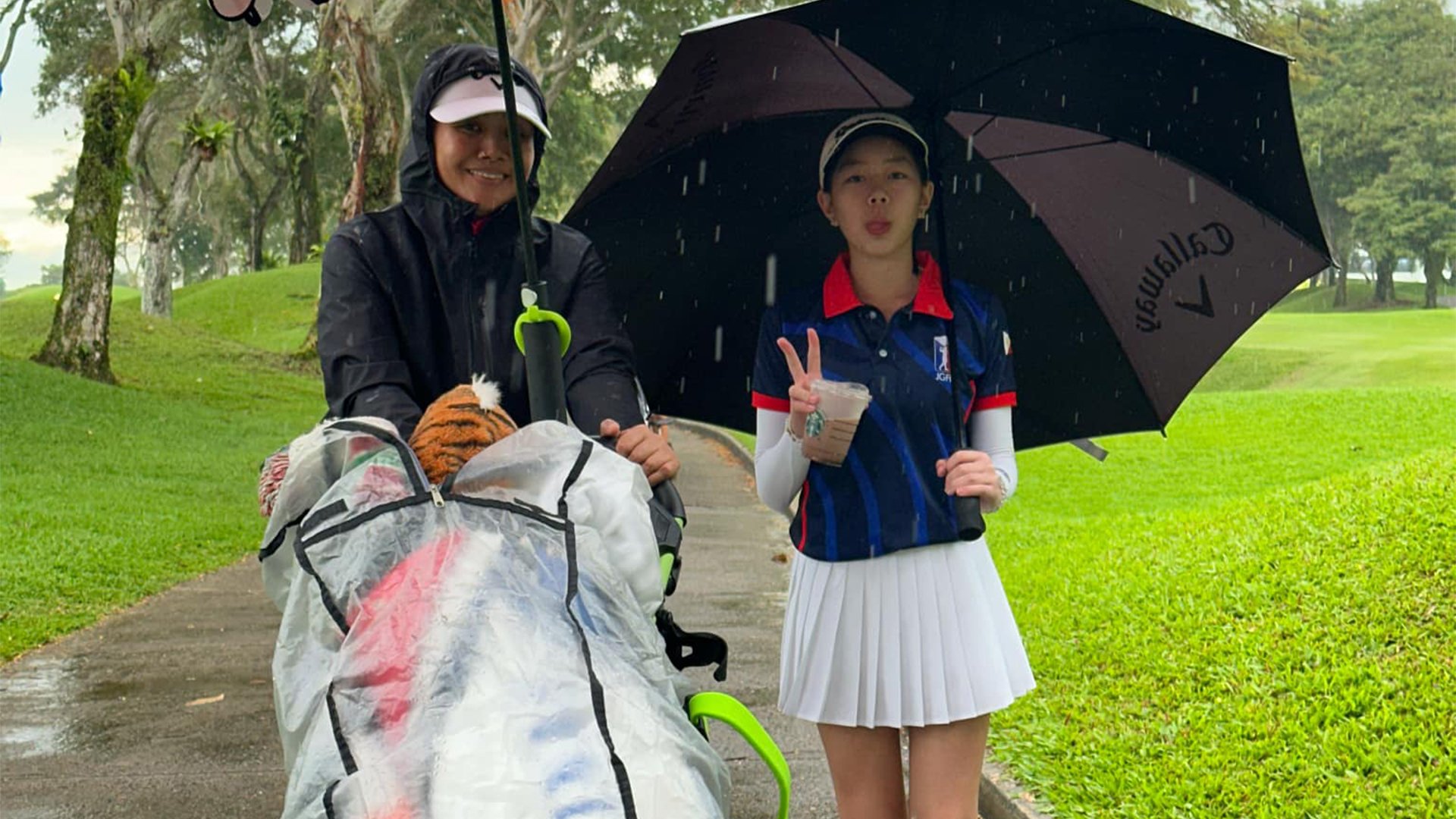 The rains can’t stop Nicole Gan (seen here with caddie, two-time LPGA Tour champion Jennifer Rosales) from taking the crown in Singapore.