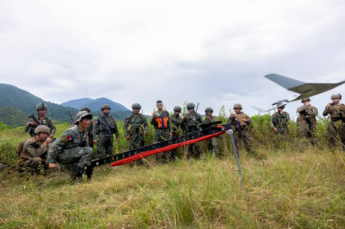 A Philippine Marine with 3rd Marine Brigade, Philippine Marine Corps, launches a Super Sweeper II small unmanned aerial system at a UAS subject matter expert exchange during KAMANDAG 7 in Iwahig, Palawan, Philippines, 13 November 2023.