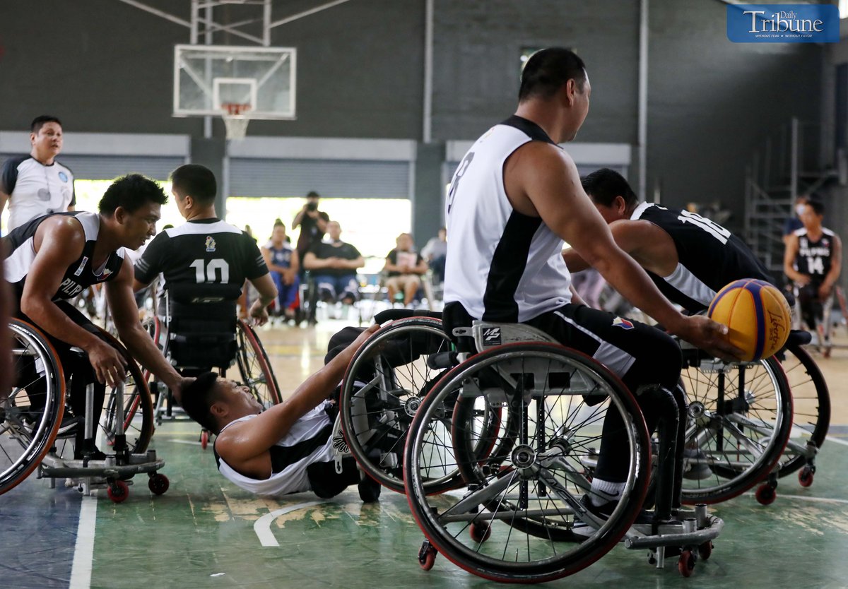 Basketball team playing on wheelchairs