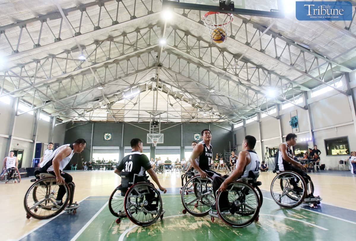 Basketball team playing on wheelchairs