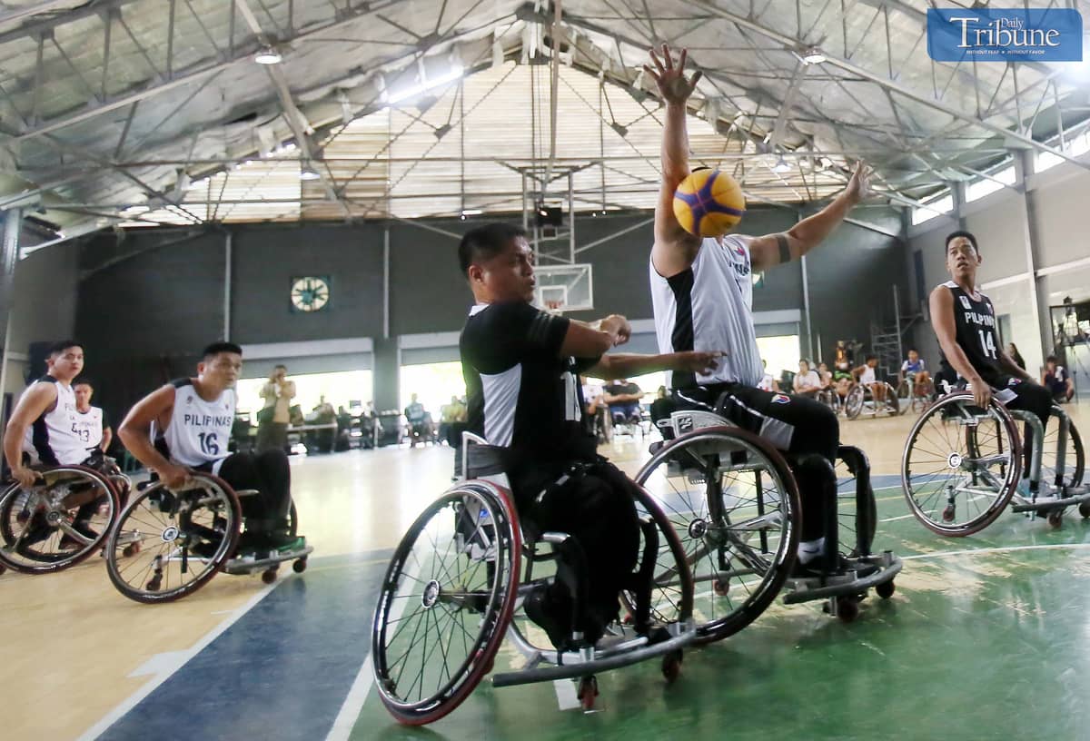 Basketball team playing on wheelchairs