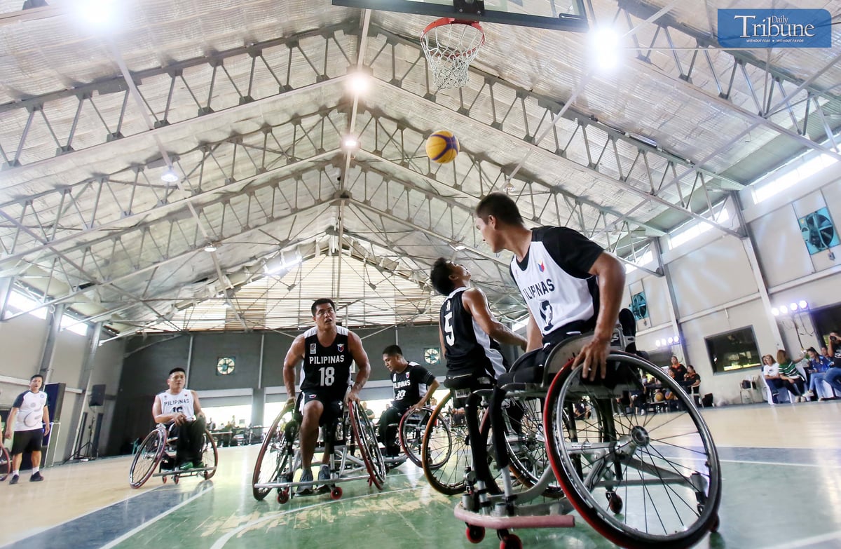 Basketball team playing on wheelchairs