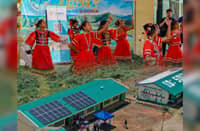 Solar panels on the roof of Gamot Integrated School in Quezon, Bukidnon. Students (top) perform during the turnover rite for the GIS electrification.