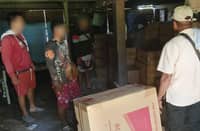 Law enforcement officers in Palawan conduct an inventory of the smuggled cigarettes in a warehouse in Brooke's Point town, southern Palawan.