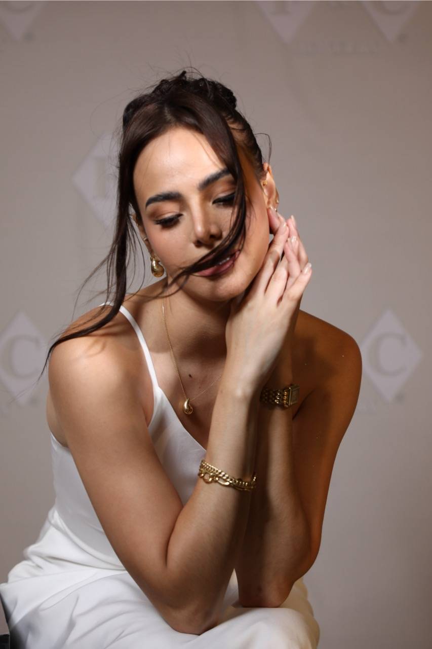As the event’s host, Sylvana Rauch needed a look that was both stylish and functional. Laureen styled her with layered gold bracelets and a delicate necklace that complemented her already elegant outfit.
