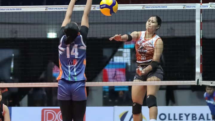 Mycah Go of the Quezon Tangerines connects an easy kill over the defense of Necelle Gual of AM Caloocan Air Force during their MPVA Season 1 game yesterday at the Quezon Convention Center.