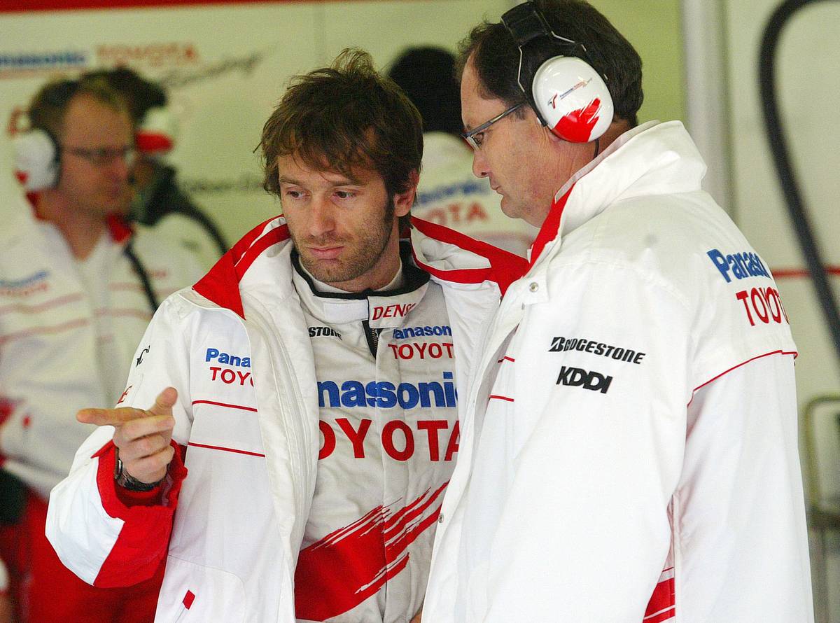 In another file photo, Toyota’s Italian Formula 1 driver Jarno Trulli (left) talks to a mechanic in the pits during a test session at the Catalonia racetrack in Montmelo near Barcelona on 26 February 2008.