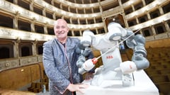 Three-armed robot conducts German orchestra