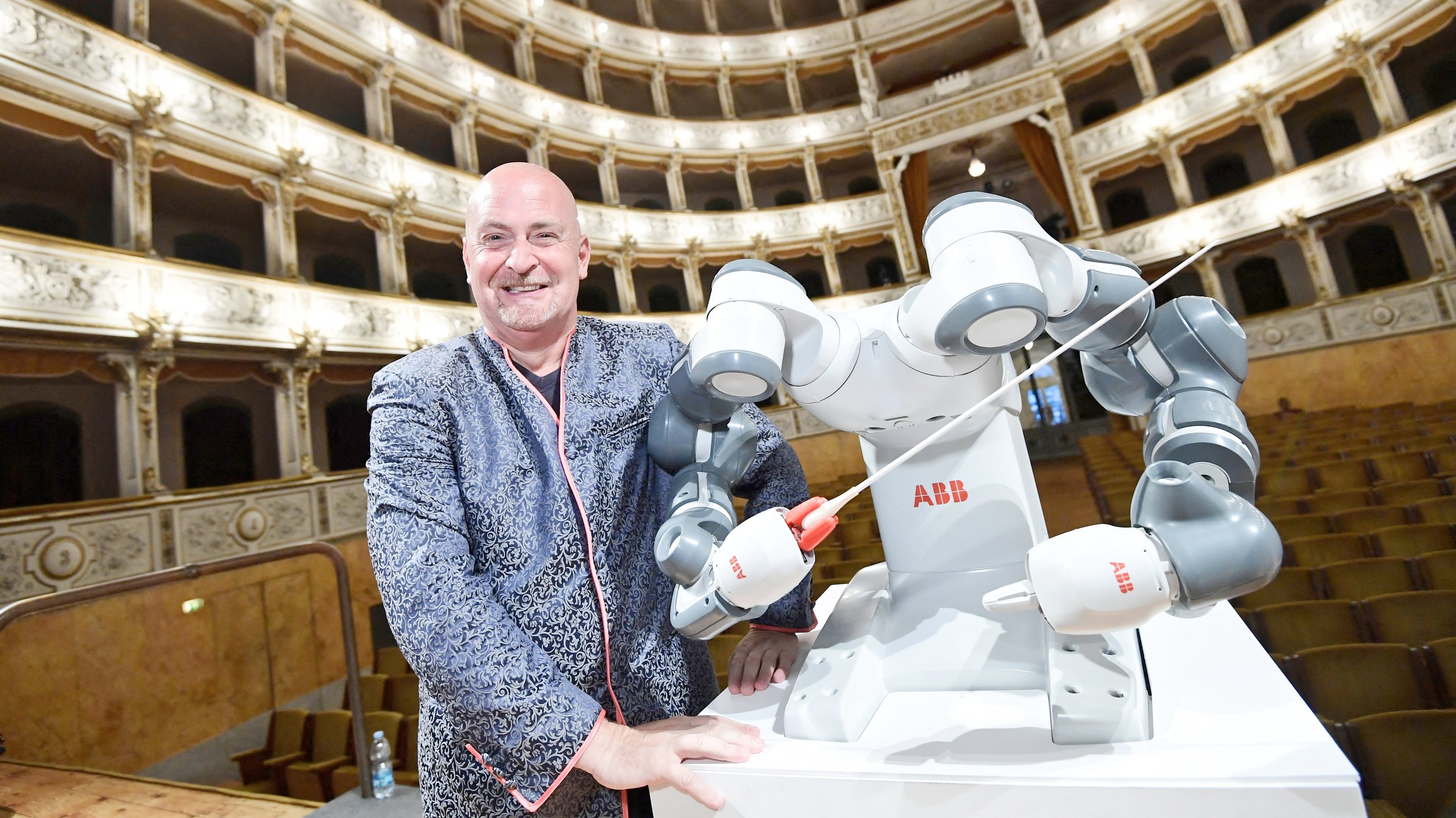 Three-armed robot conducts German orchestra