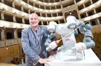 ITALIAN conductor Andrea Colombini poses with the robot ‘Yumi’ during a rehearsal prior to a concert where Yumi will conduct the Lucca Philharmonic Orchestra at The Teatro Verdi in Pisa.