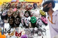 Children browse through spooky Halloween masks for sale along Commonwealth Avenue in Quezon City on Thursday, 17 October 2024. Halloween, celebrated on 31 October, is observed in many countries as the eve of the Western Christian feast of All Hallows' Day. Photos by ANALY LABOR