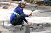 TRIBUNE-10-19-24-worker-installing-concrete