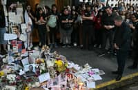 LOOK: Geoff Payne (R), the father of One Direction pop singer Liam Payne, looks at the place where fans paid tribute to his late son outside the CasaSur Hotel in Buenos Aires on 18 October 2024. The father of One Direction pop singer Liam Payne, whose death in a fall from a hotel balcony in Buenos Aires shocked the music world, arrived in Argentina on Friday, police sources told AFP. The singer suffered "multiple traumas" and "internal and external hemorrhaging" after falling from the balcony of his room on the third floor of the Casa Sur hotel in central Buenos Aires on Wednesday night, an autopsy found. | Photo courtesy of JUAN MABROMATA / AFP