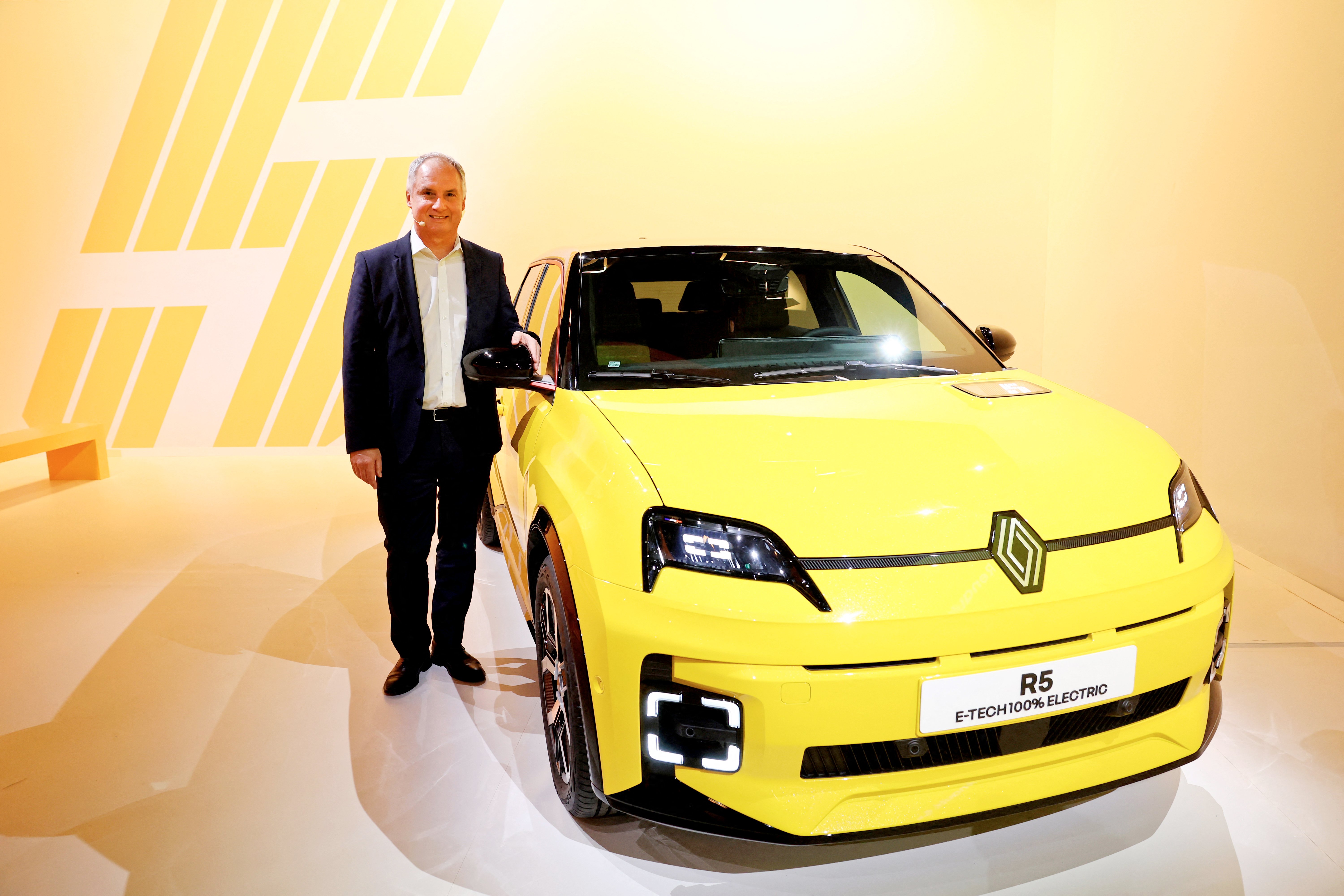 Renault Brand CEO Fabrice Cambolive poses next to a Renault 5 E-TECH Electric in the Paris suburb of Aubervilliers, giving a boost to the French automaker’s electrification plans.
