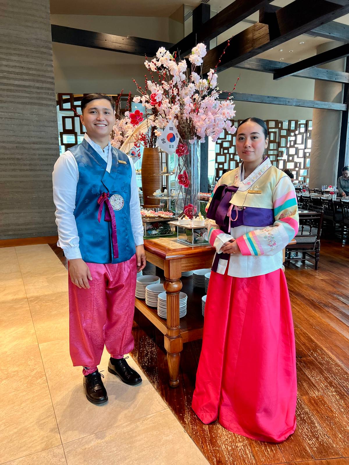 Receptionists welcome guests to the Korean food fest.