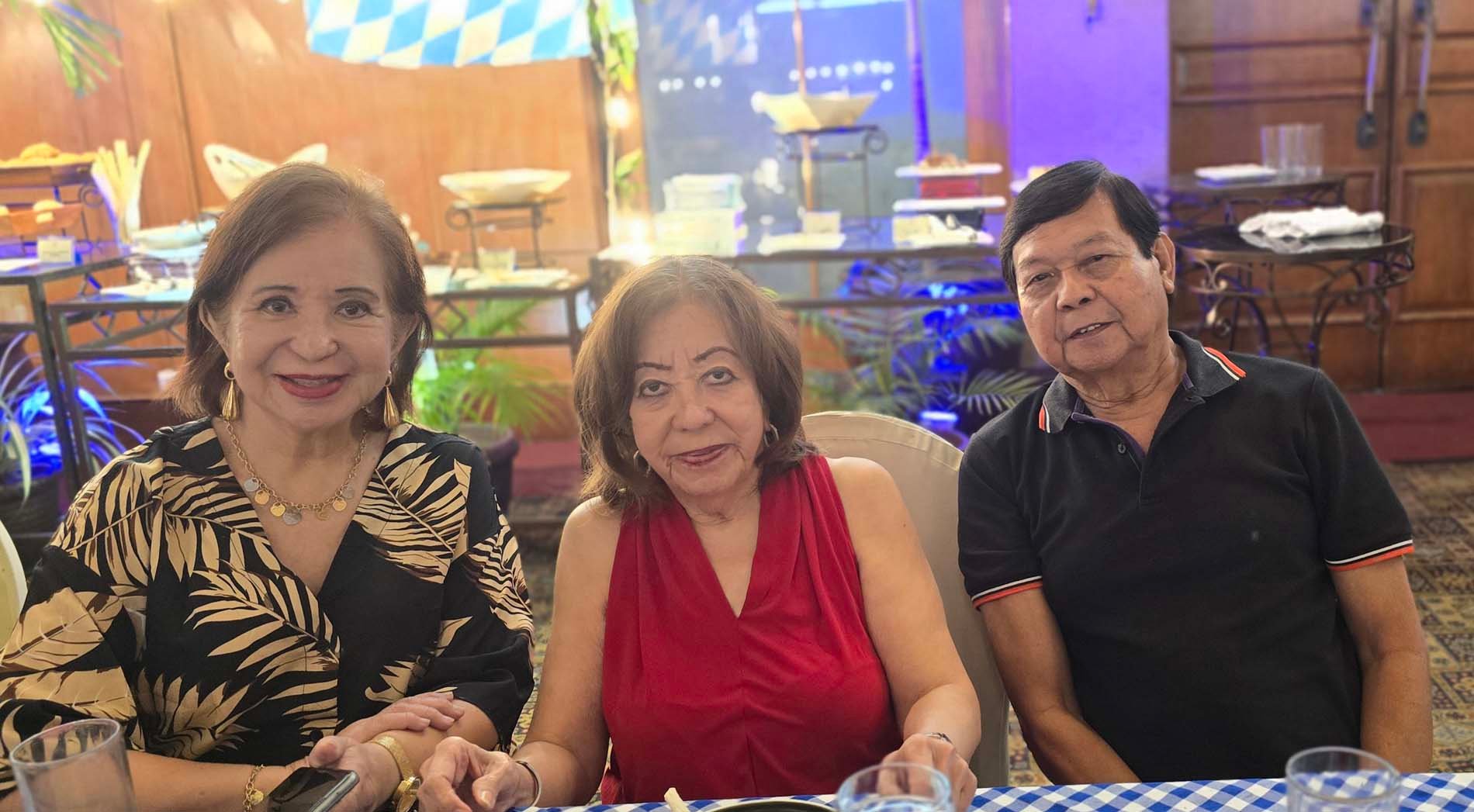 Carmelita Palacios with Alberto and Marita Domingo.