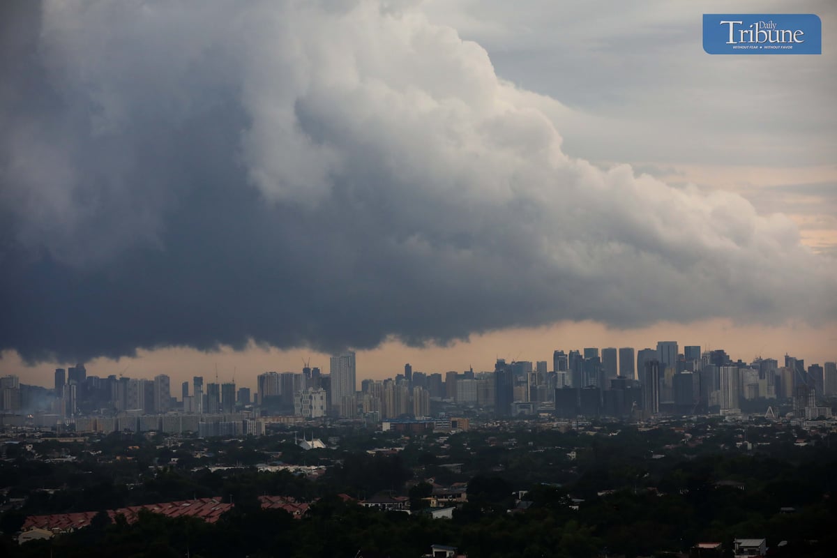 Dark clouds cover Metro Manila ahead of Tropical Depression Kristine's landfall.