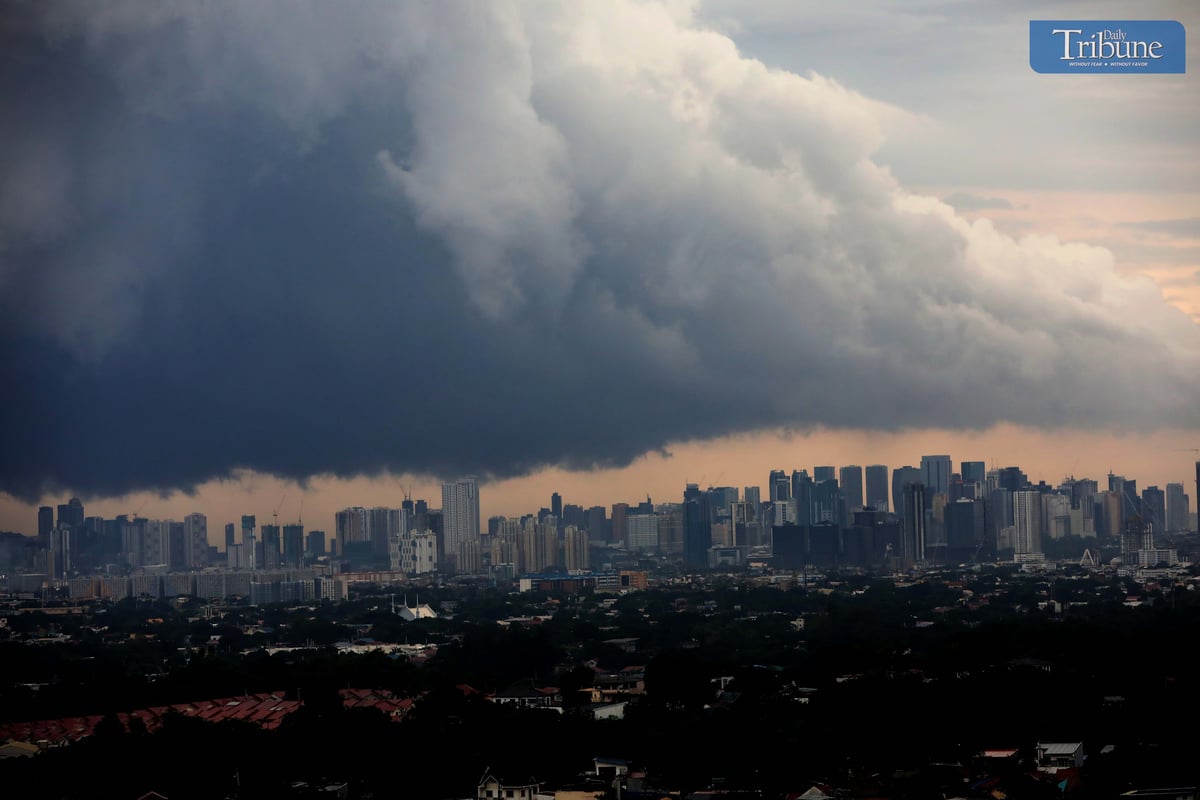 Dark clouds cover Metro Manila ahead of Tropical Depression Kristine's landfall.