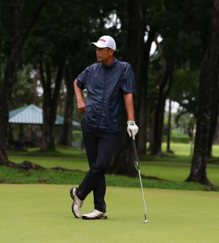 Despite the cranky weather, Michael Bibat stays calm and focused en route to a four-under 66 for a two-stroke lead in the opening round of the