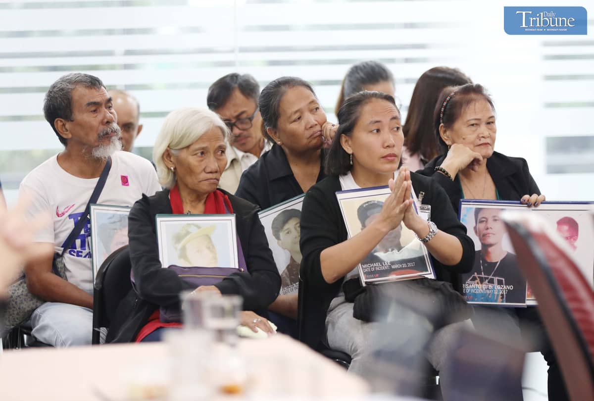 Families of drug war victims at Quad Comm hearing.