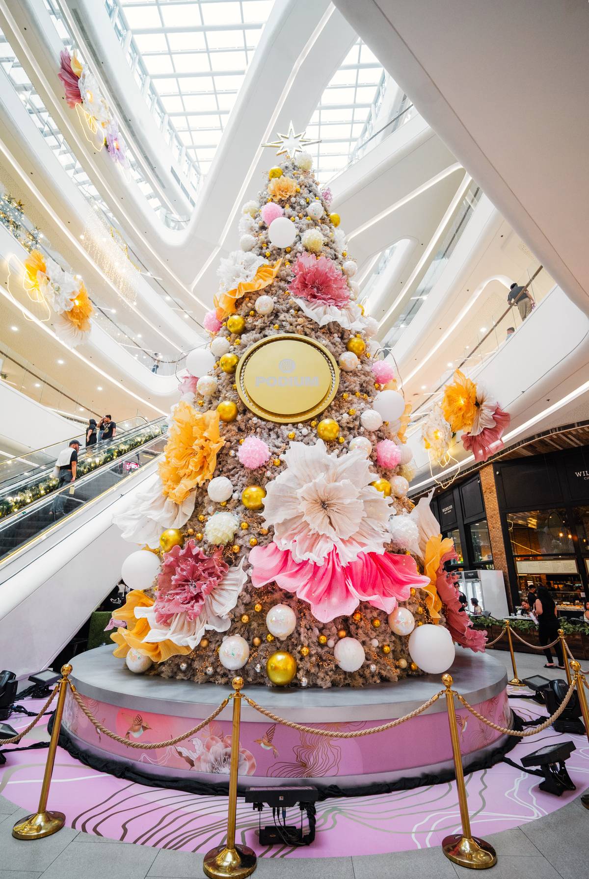 SM Podium's Holidays are in Bloom Christmas celebration features gold, ivory, lilac, and soft rose blooms.