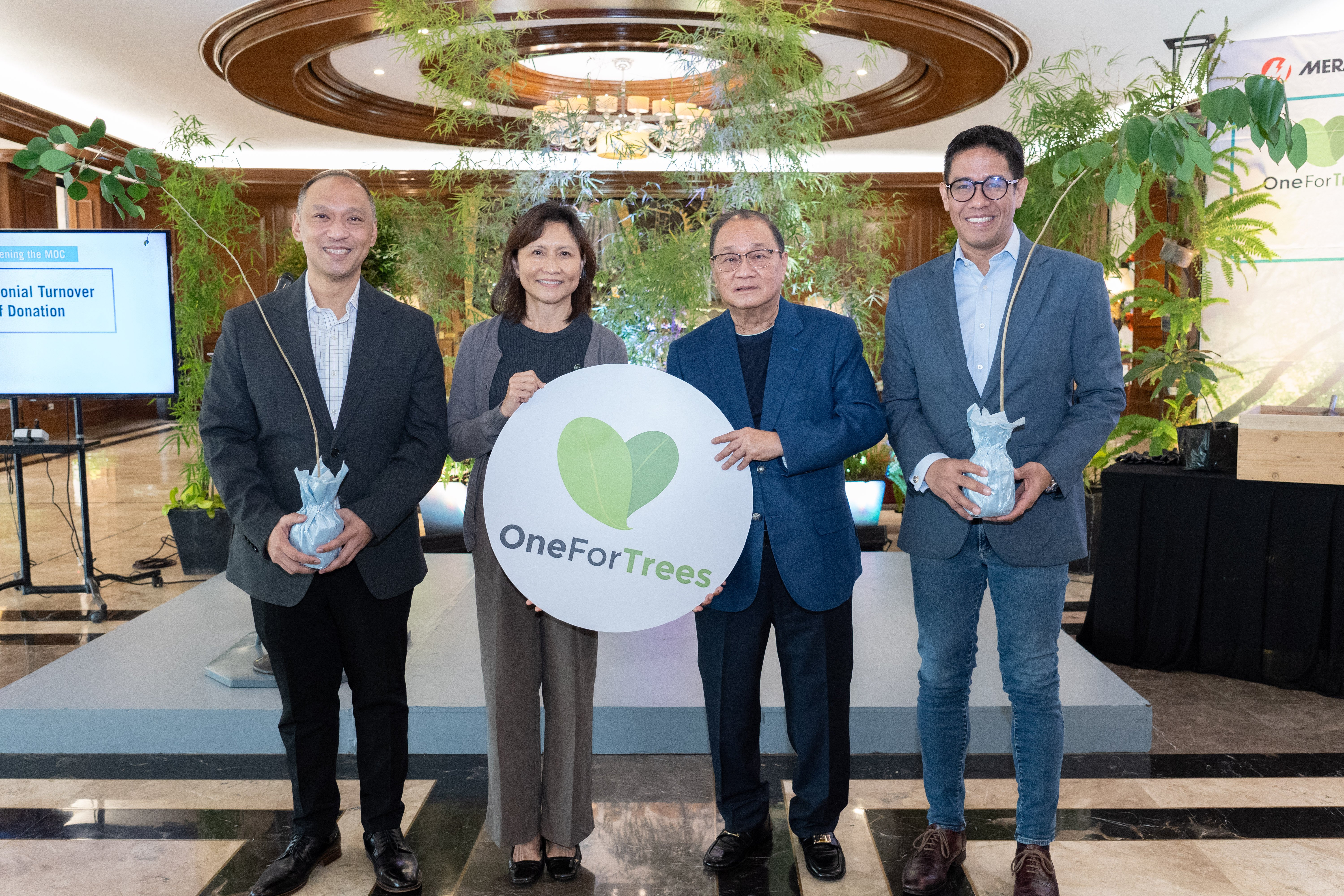 PRESERVING THE PLANET. Meralco chairman and CEO Manuel V. Pangilinan (second from right) leads the acceptance of tree seedlings from Communications Electrical Equipment & Supply Co., Inc. (Celeasco) president Natalie G. Siy. The donated seedlings will form part of Meralco’s greening initiative under the One For Trees and PowerPlants environmental programs. With them are One Meralco Foundation president Jeffrey O. Tarayao (left) and Meralco first vice president and chief sustainability officer Raymond B. Ravelo (right).