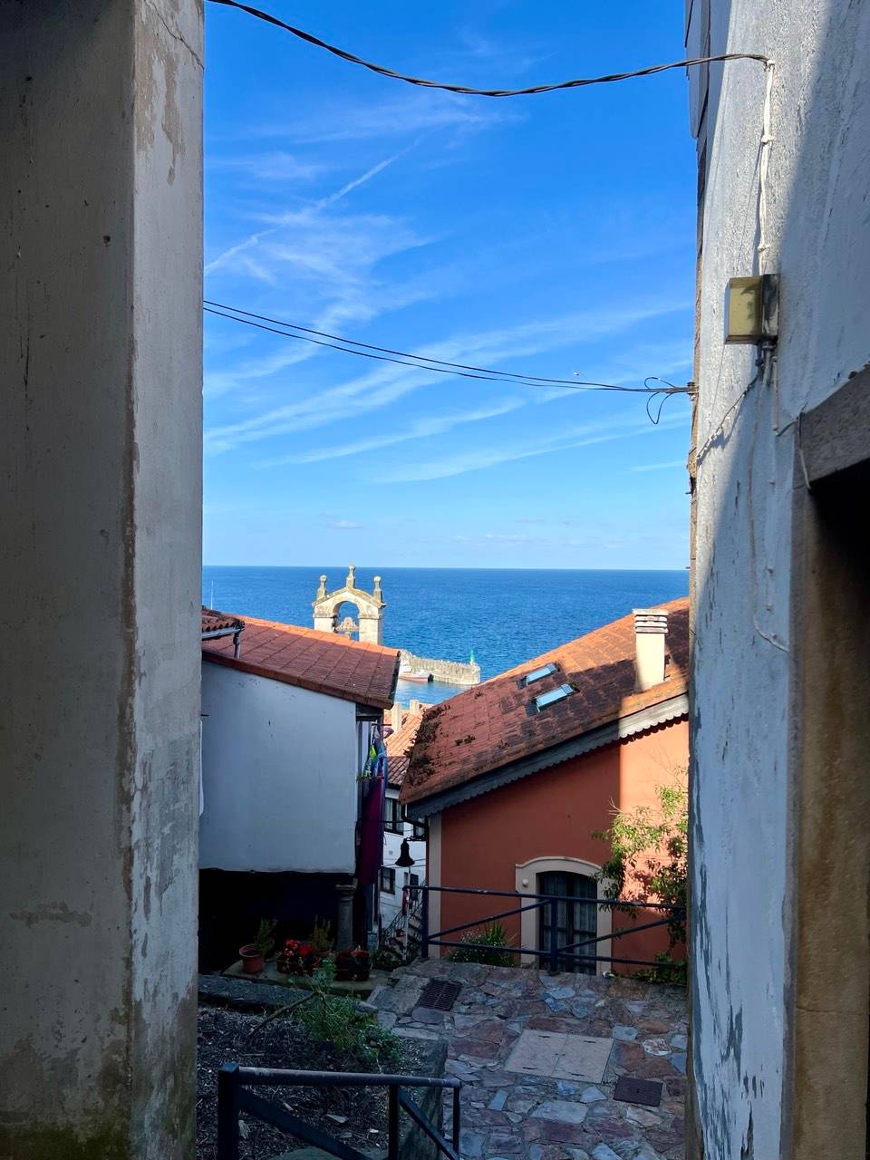The narrow streets cascade down to the sea