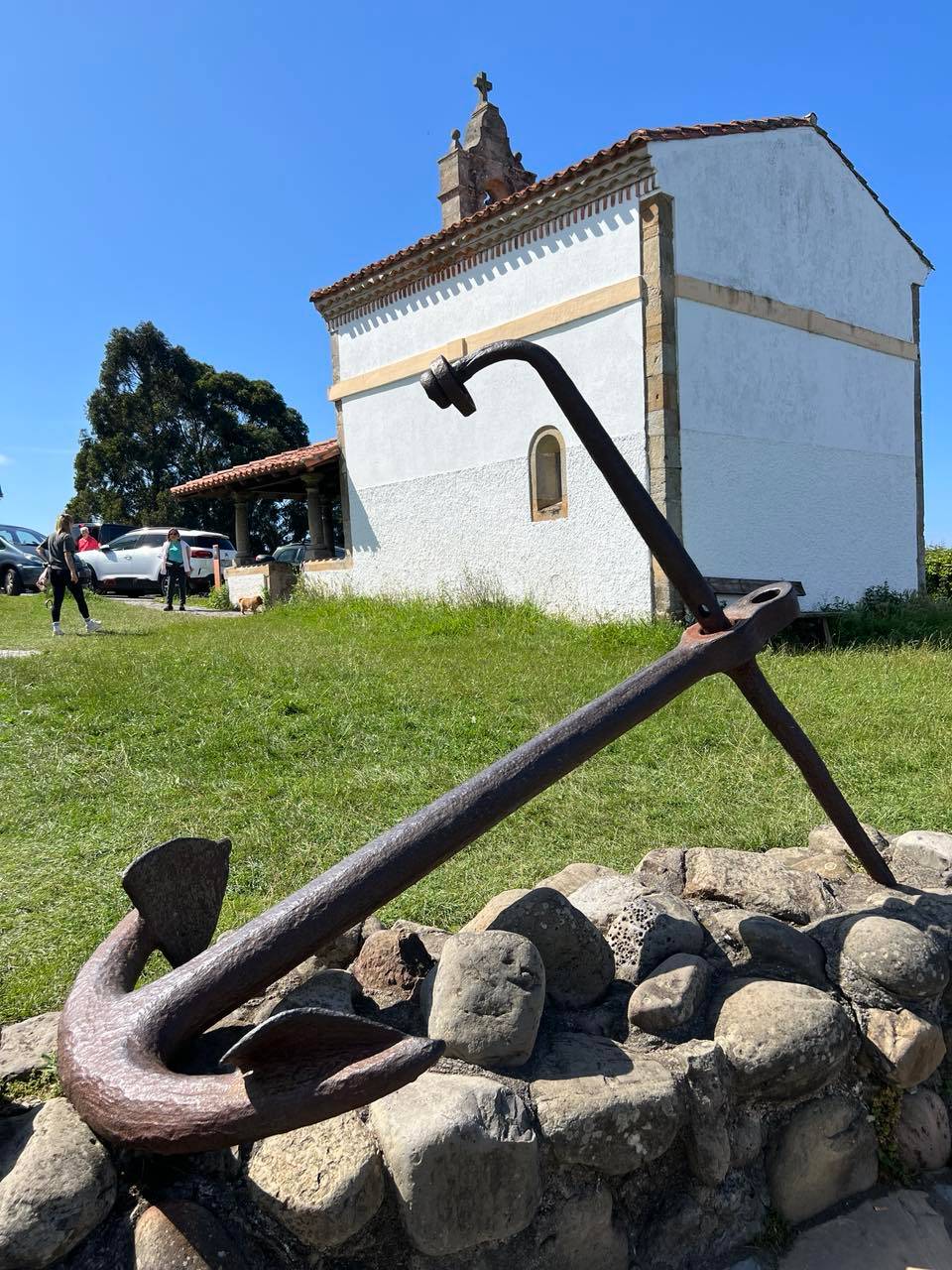 An anchor rests near the coast