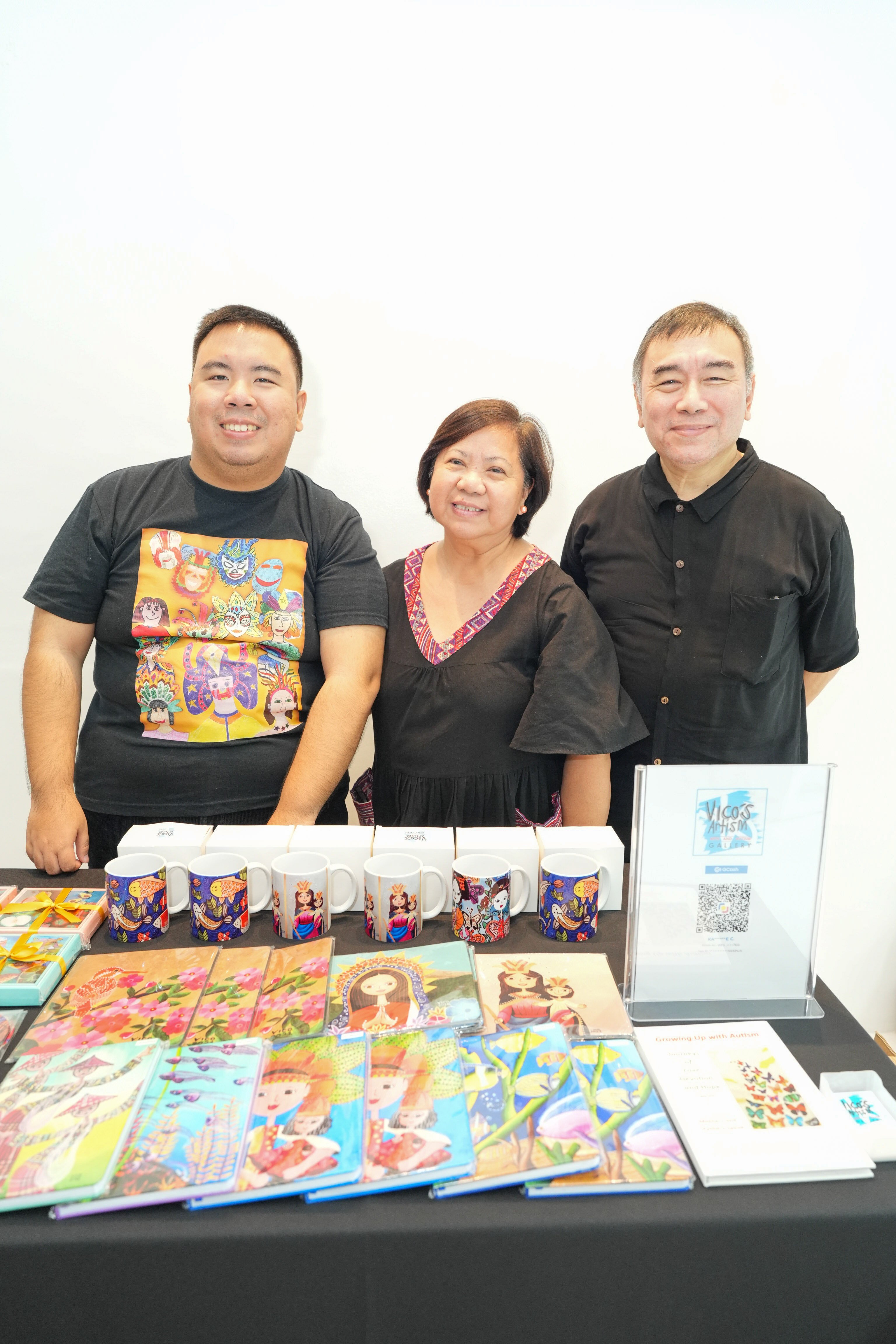 Book illustrator Vivo Cham with parents Jun and Cathy Cham.