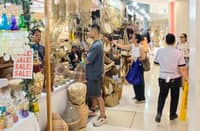 Staff of the Marinduque Tourism Office (left) prepares the products of the province during the Tatak Pinoy: OBRA MIMAROPA at the Glorietta 3 Activity Center in Makati City on Sunday. Other booths (above) in the trade fair feature diverse products.