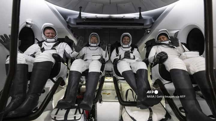 IN SPACE - OCTOBER 25: (EDITOR’S NOTE: This Handout image was provided by a third-party organization and may not adhere to Getty Images’ editorial policy.) In this NASA handout, Roscosmos cosmonaut Alexander Grebenkin (L) NASA astronauts Michael Barratt (2nd L) Matthew Dominick (2nd R) and Jeanette Epps (R) are seen inside the SpaceX Dragon Endeavour spacecraft onboard the SpaceX recovery ship MEGAN shortly after having landed in the Gulf of Mexico off the coast of Pensacola, Florida on October 25, 2024. Dominick, Barratt, Epps, Grebenkin are returning after seven-months in space as part of Expedition 70 aboard the International Space Station. Joel Kowsky/NASA via Getty Images/AFP
