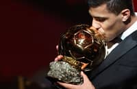 Rodri lifts the Ballon d’Or trophy after winning four consecutive Premier League title and the Euro 2024 crown.