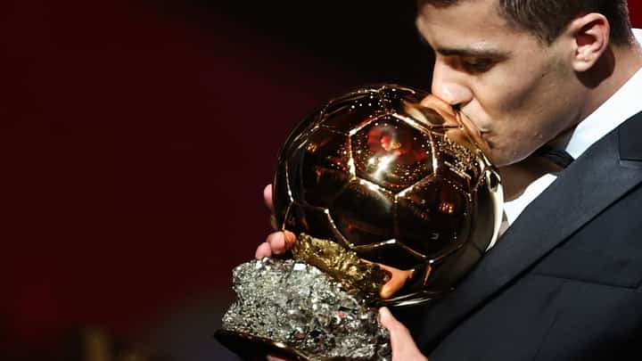 Rodri lifts the Ballon d’Or trophy after winning four consecutive Premier League title and the Euro 2024 crown.