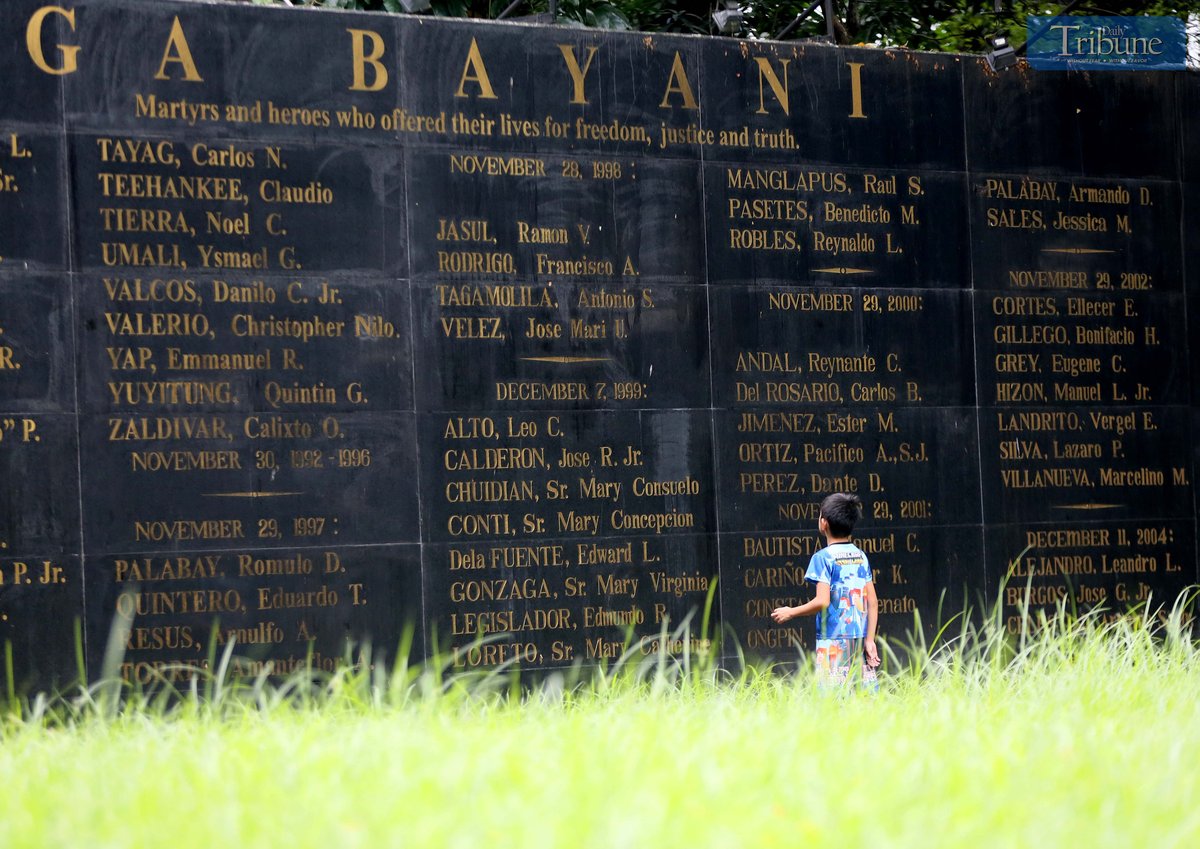 On Saturday, 2 November 2024, a boy visits the Wall of Remembrance at Bantayog ng mga Bayani in Quezon City, a monument bearing the names of martyrs and heroes.