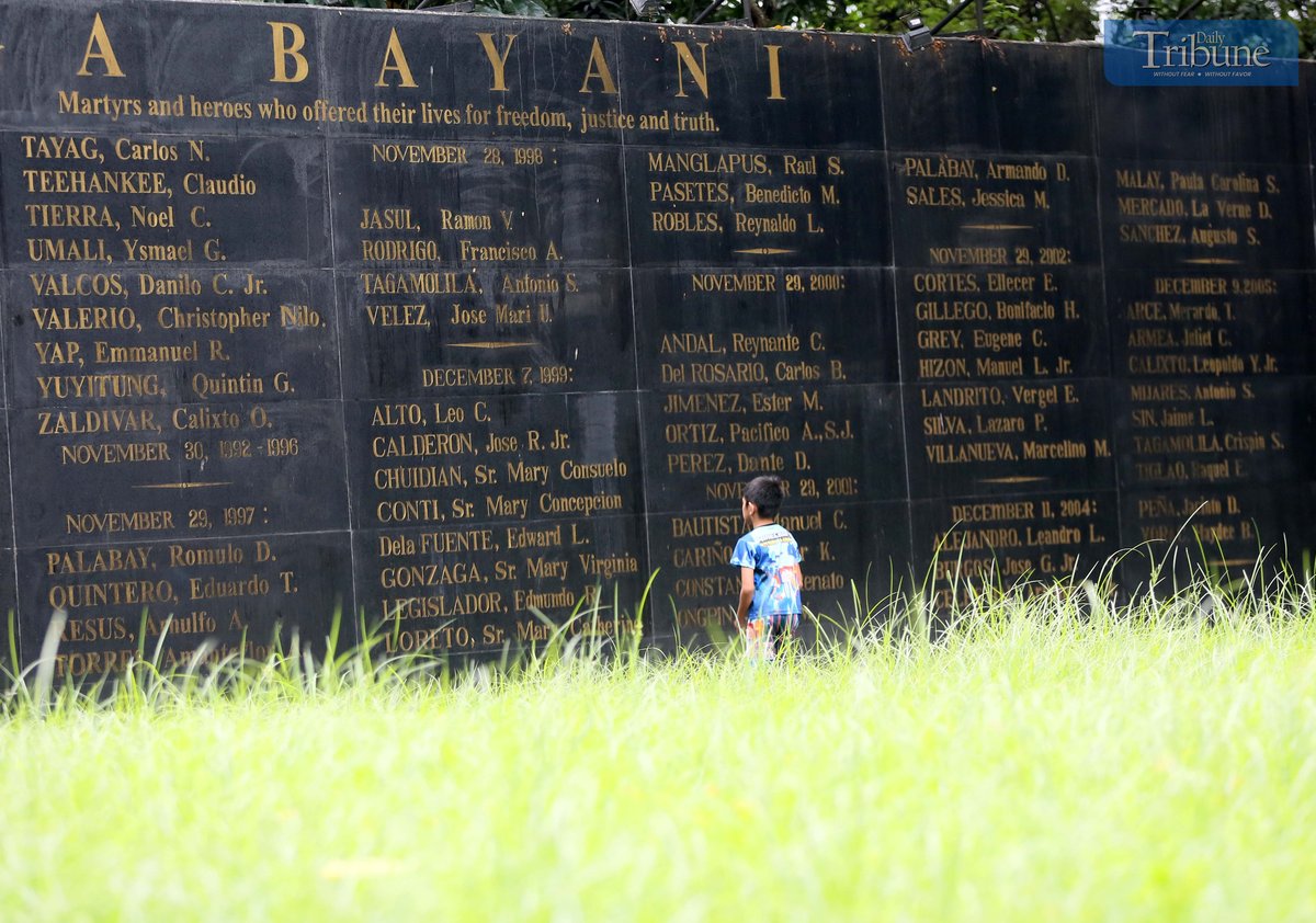 On Saturday, 2 November 2024, a boy visits the Wall of Remembrance at Bantayog ng mga Bayani in Quezon City, a monument bearing the names of martyrs and heroes.