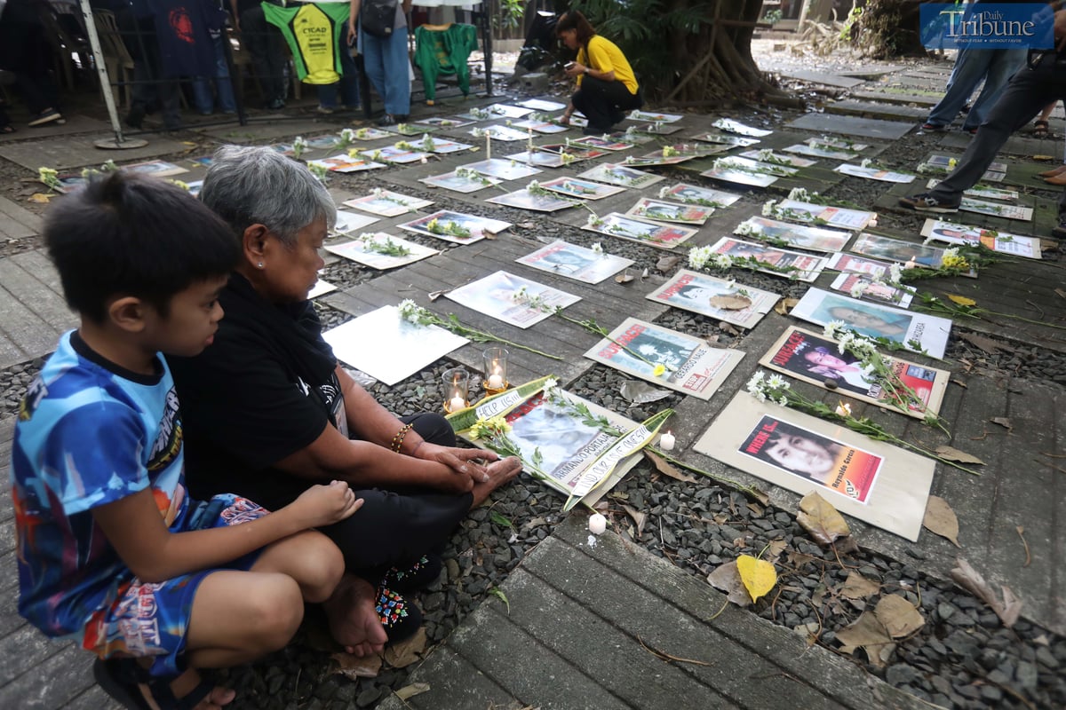 Families of Desaparecidos commemorate the victims of enforced disappearances with flowers and candles on All Souls Day.