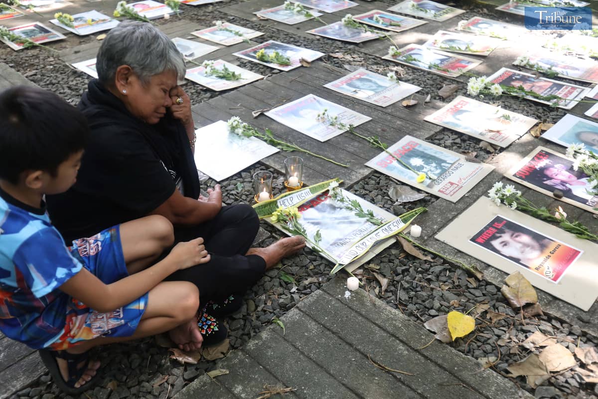 Families of Desaparecidos commemorate the victims of enforced disappearances with flowers and candles on All Souls Day.