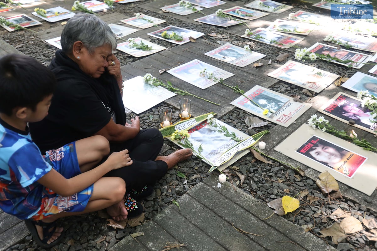 Families of Desaparecidos commemorate the victims of enforced disappearances with flowers and candles on All Souls Day.