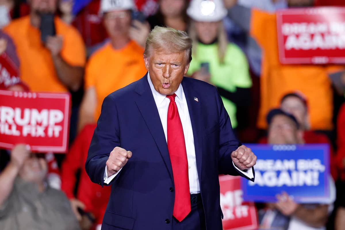 But will he sway voters his way? Former US President and Republican presidential candidate Donald Trump dances as he walks on stage during a campaign rally at Van Andel Arena in Grand Rapids, Michigan on 5 November.