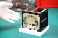 HISTORIC FIRST. This file photo taken on May 28, 2024 shows the world’s first satellite made from wood, named LignoSat, developed by scientists at Kyoto University and logging company Sumitomo Forestry, during a press conference in Kyoto. The world’s first wooden satellite has blasted off on a SpaceX rocket, its Japanese developers said on Nov. 5, 2024, part of an resupply mission to the International Space Station.