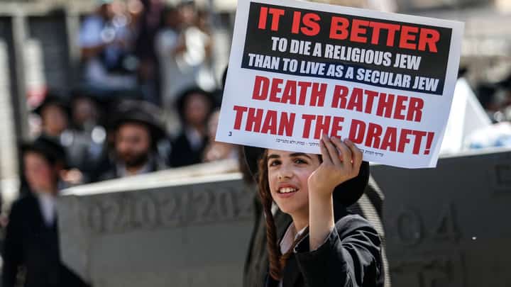 Israeli police officers intervene in Ultra-Orthodox Jews who gather to stage a protest against mandatory military service in West Jerusalem, Israel, on August 21, 2024.