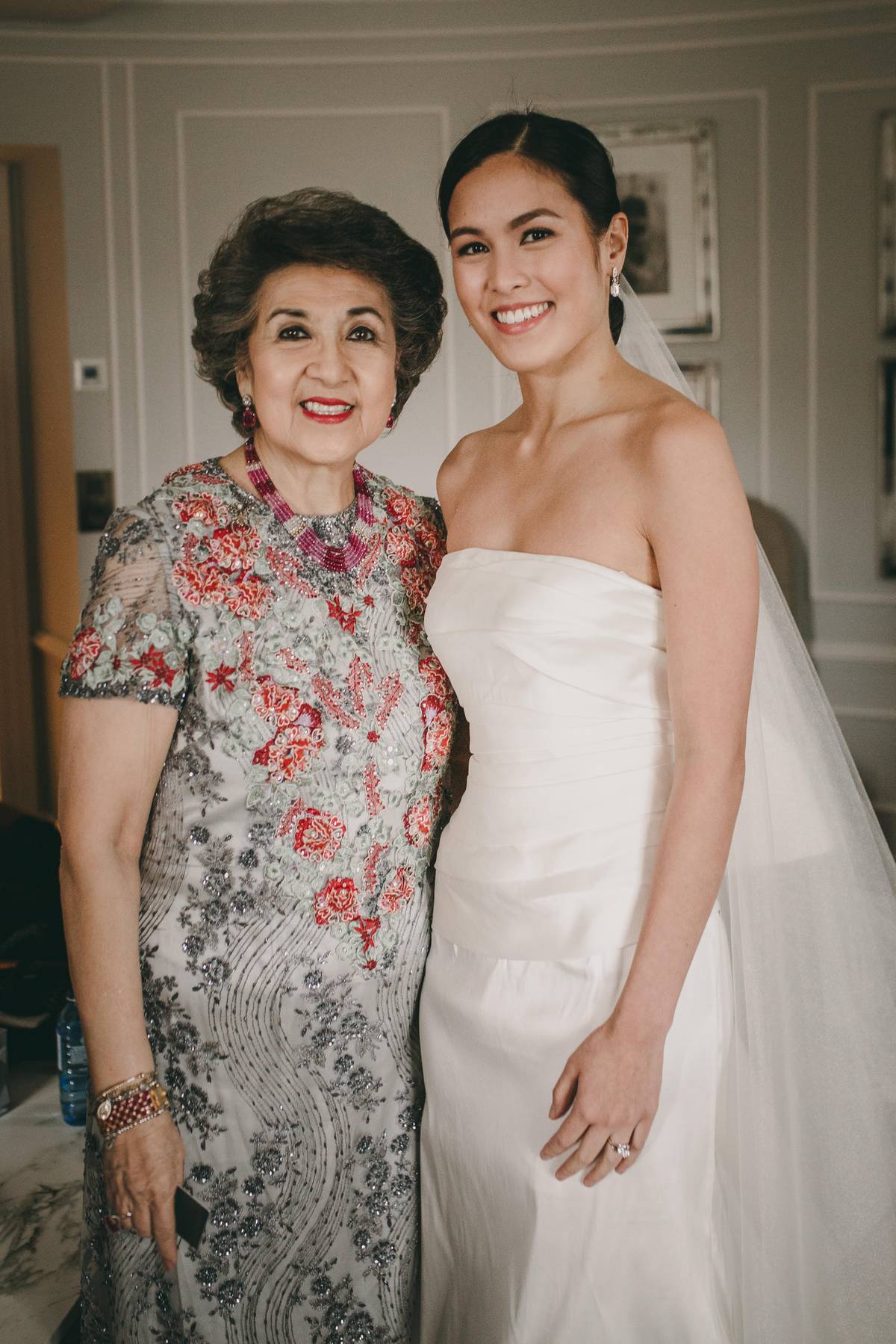 Custom Patis Tesoro jacket and dress made with Inabel, embellished with French Lace she inherited from her mother, at the wedding of her granddaughter Sammy Pineda-Barrera.