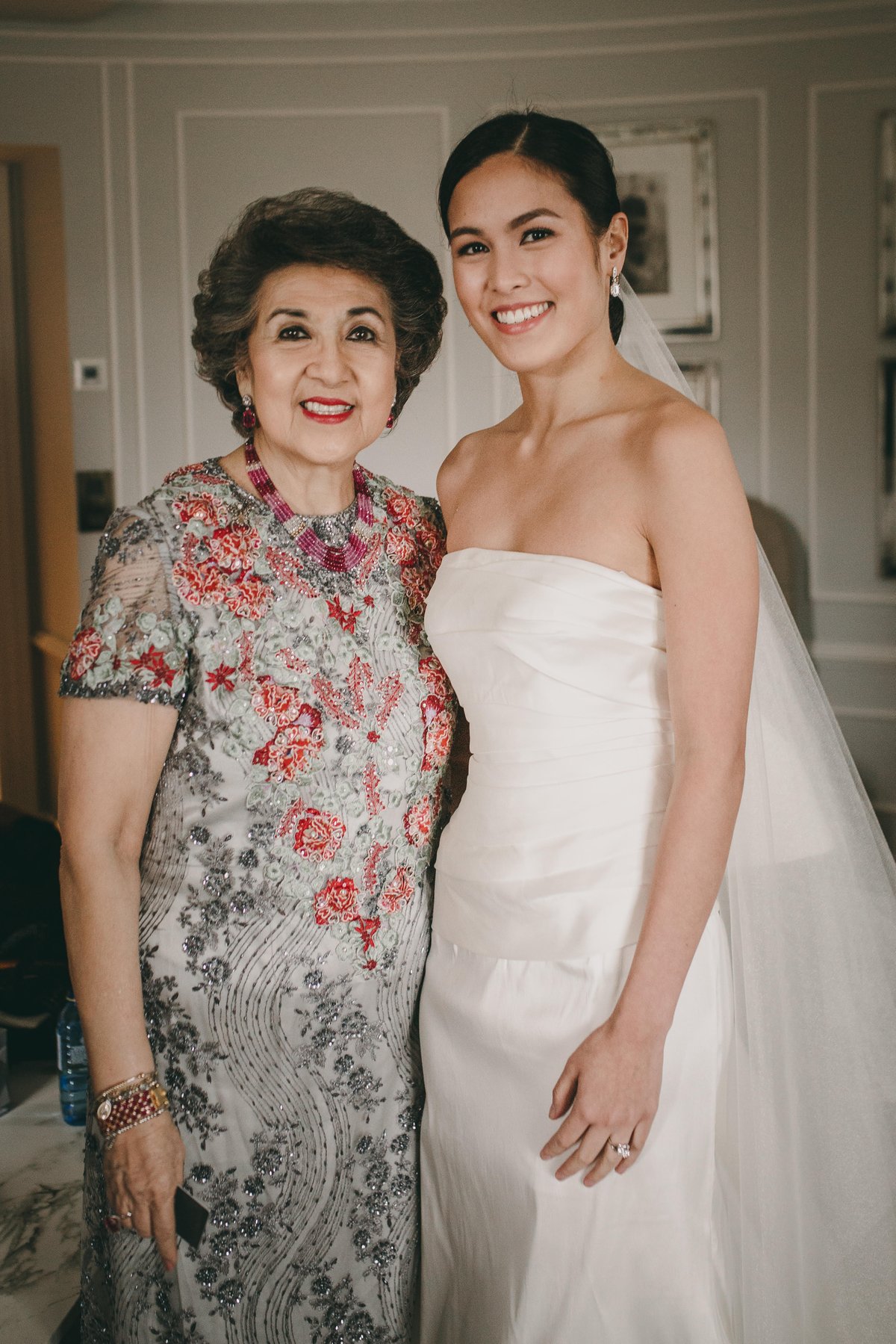 Custom Patis Tesoro jacket and dress made with Inabel, embellished with French Lace she inherited from her mother, at the wedding of her granddaughter Sammy Pineda-Barrera.